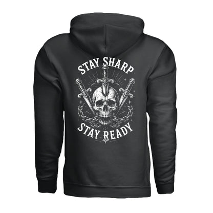 A black pullover hoodie shown from the back, featuring a large white graphic print of a skull, crossed swords, and the words 'STAY SHARP' and 'STAY READY'.